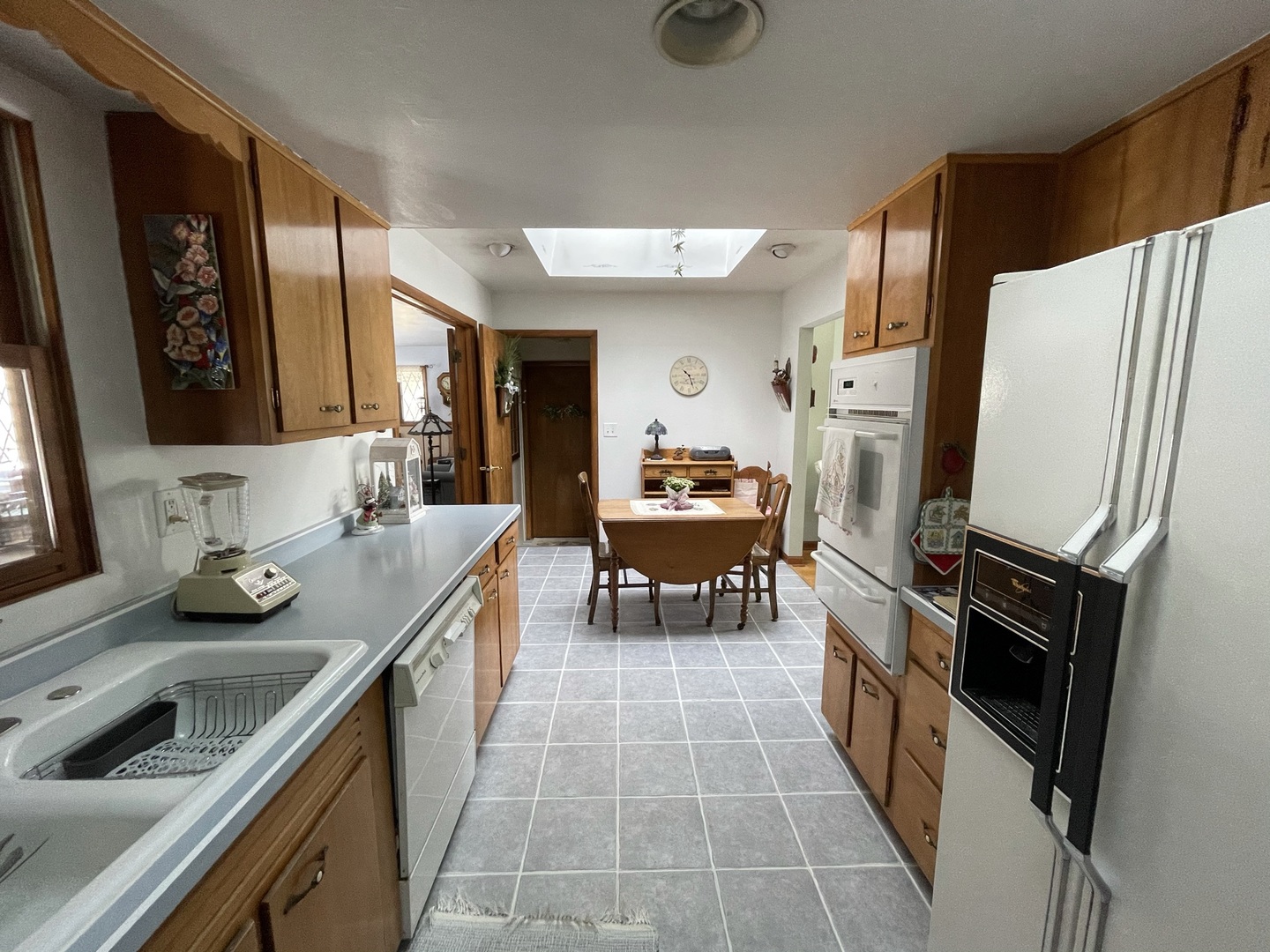 216 Pauline Drive Elgin, IL 60123 - Photo 10 of 20 a kitchen with stainless steel appliances granite countertop a sink stove and refrigerator