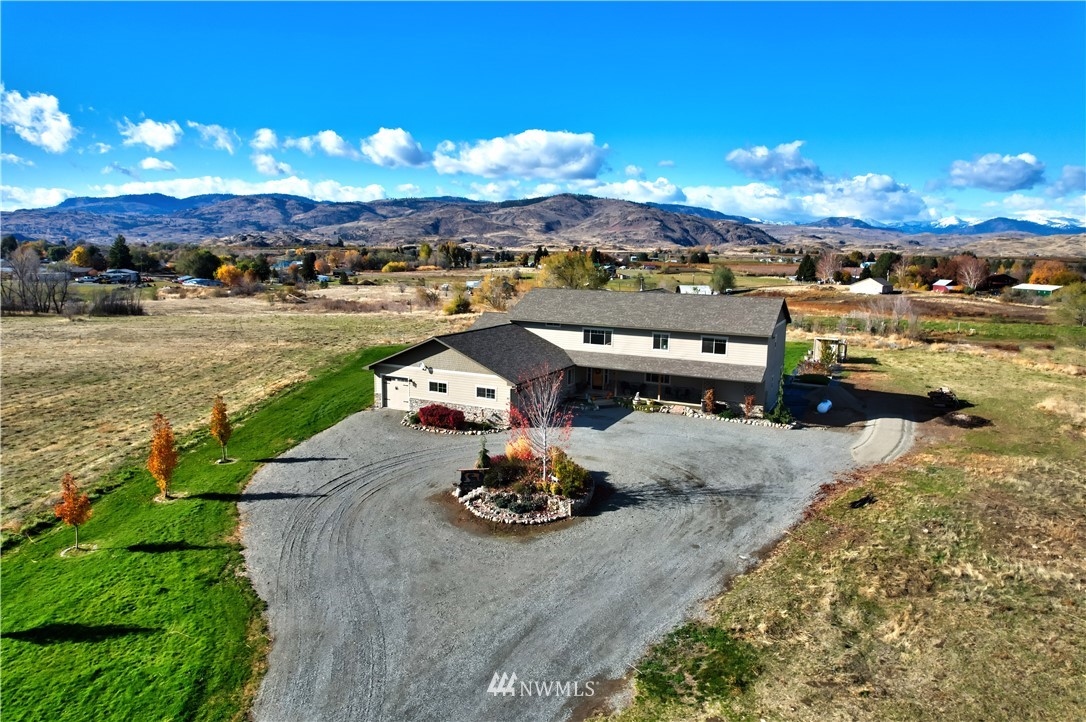 81 Jaquish Road Omak, WA 98841 - Photo 2 of 40 a view of a lake with lawn chairs