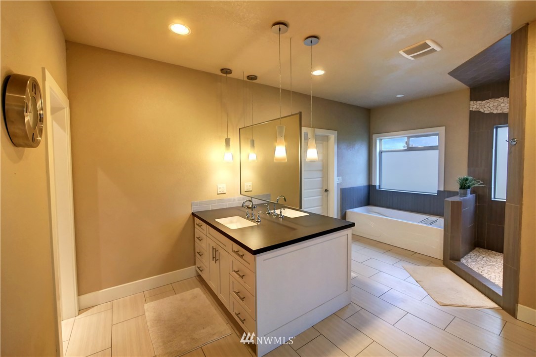 81 Jaquish Road Omak, WA 98841 - Photo 28 of 40 a kitchen with sink cabinets and stove