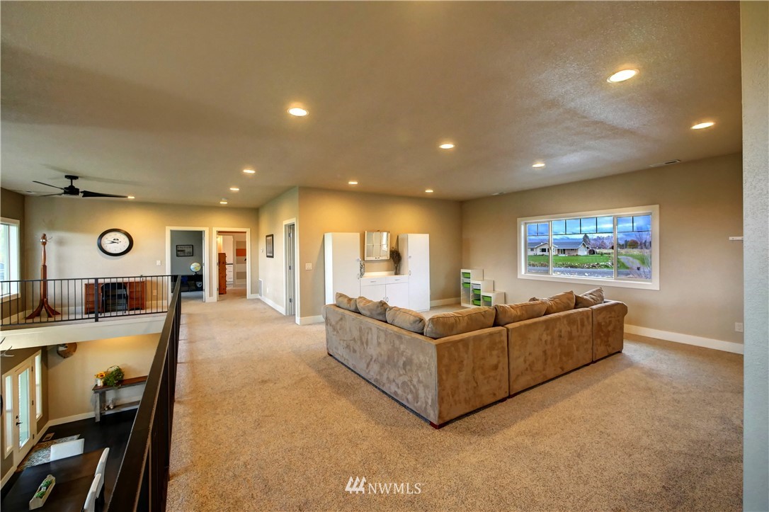 81 Jaquish Road Omak, WA 98841 - Photo 31 of 40 a living room with furniture and a flat screen tv