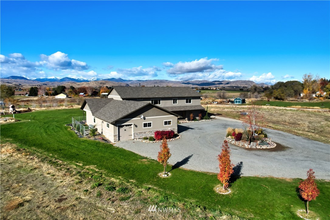 81 Jaquish Road Omak, WA 98841 - Photo 40 of 40 an aerial view of a house with yard swimming pool and outdoor seating