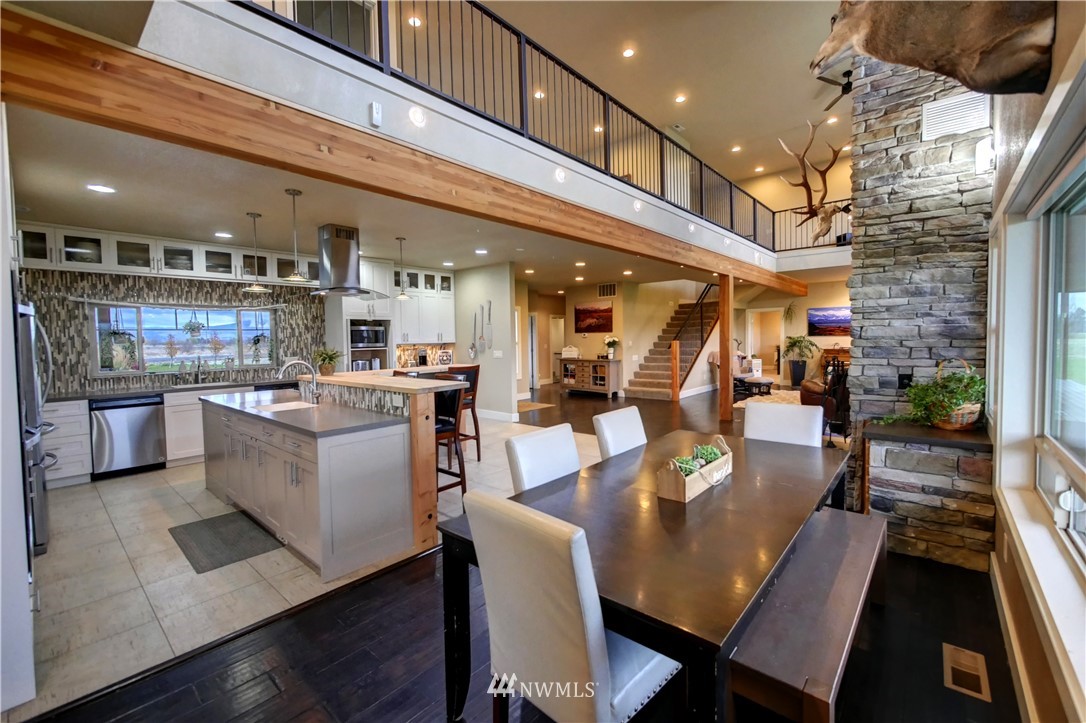 81 Jaquish Road Omak, WA 98841 - Photo 6 of 40 a large kitchen with a table and chairs