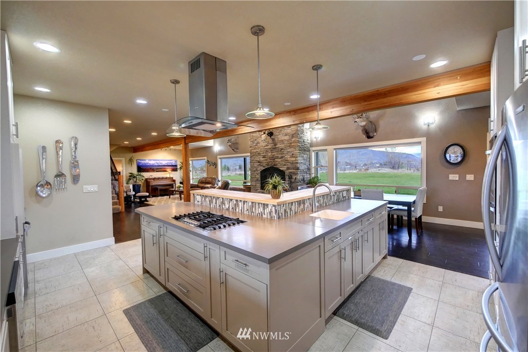 81 Jaquish Road Omak, WA 98841 - Photo 8 of 40 a kitchen with stainless steel appliances granite countertop a sink and a stove