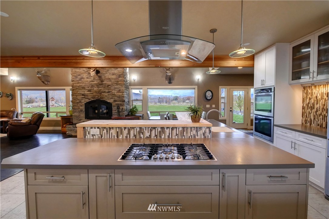 81 Jaquish Road Omak, WA 98841 - Photo 9 of 40 a kitchen with a stove and cabinets