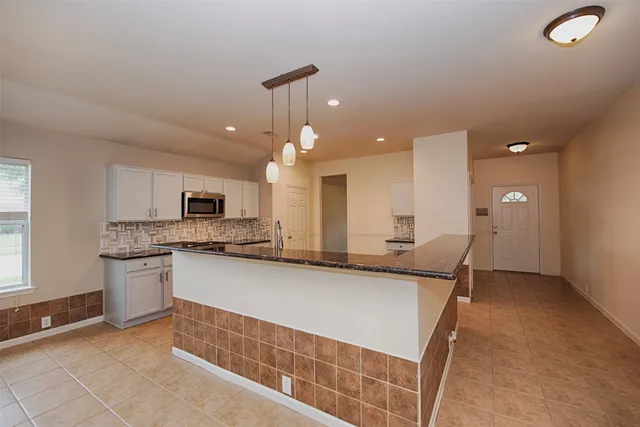 a view of a backyard of the house