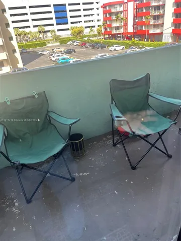 a view of a chairs and table in a patio