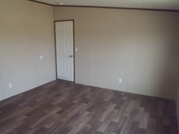 a view of walk in closet with clothes