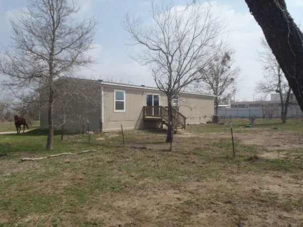 a house view with a backyard space