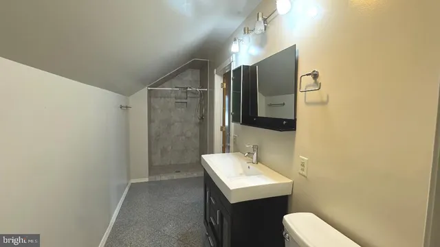 a bathroom with a sink and mirror