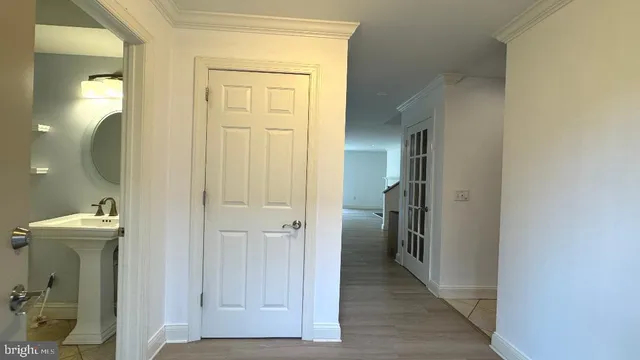 a view of a bathroom from a hallway