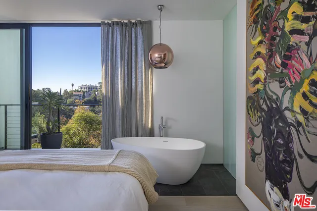 a view of a bathtub in front of a window