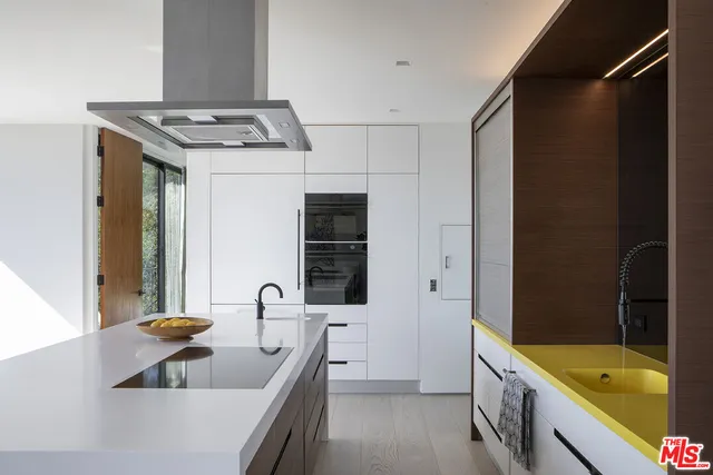 a bathroom with a sink a bathtub and a window