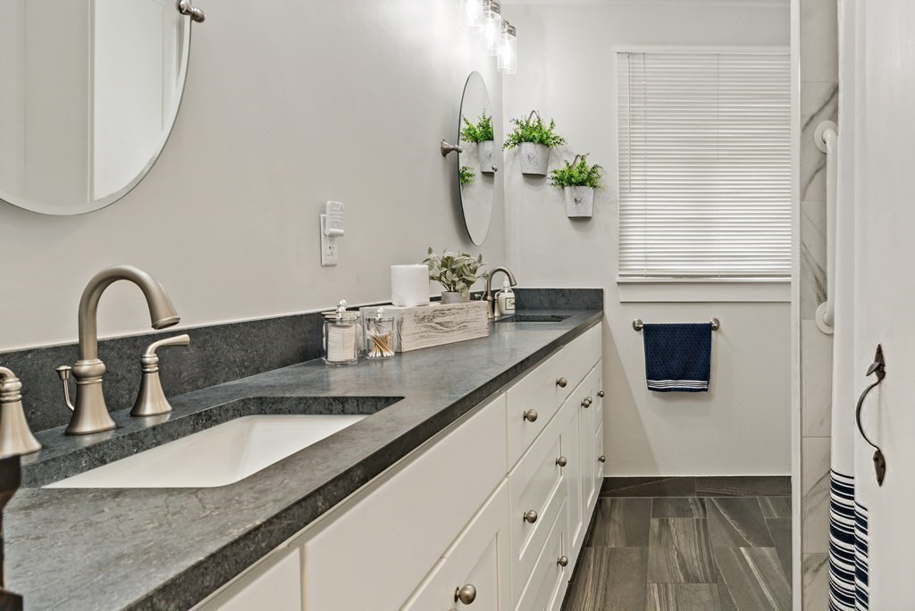 482 Delano Road Marion, MA 02738 - Photo 17 of 35 a bathroom with a sink a potted plant and a window