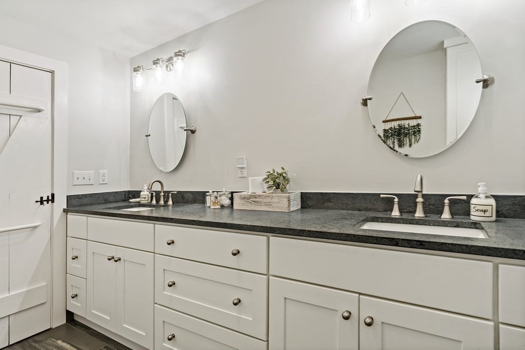 482 Delano Road Marion, MA 02738 - Photo 18 of 35 a bathroom with a granite countertop double vanity sinks and a mirror