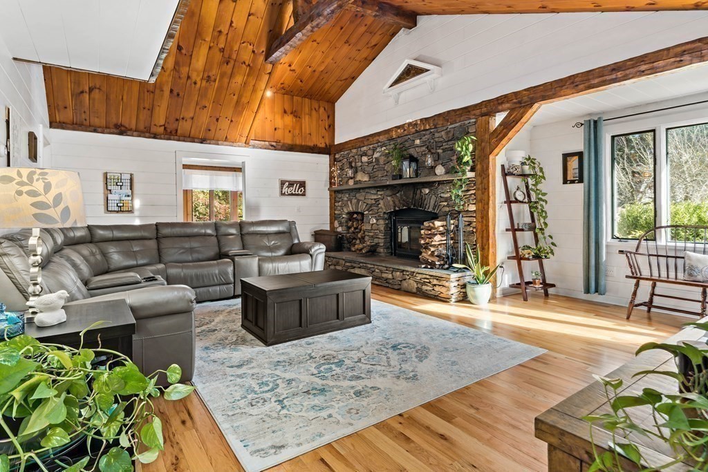 482 Delano Road Marion, MA 02738 - Photo 8 of 35 a living room with furniture and a fireplace