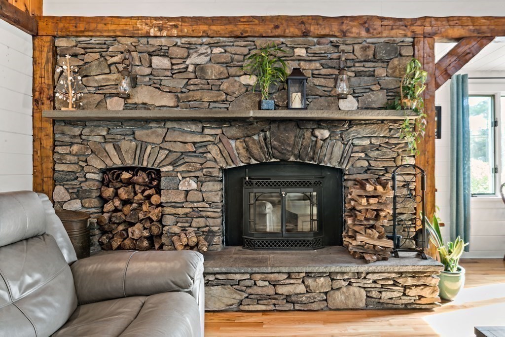 482 Delano Road Marion, MA 02738 - Photo 9 of 35 a living room with a couch and a fireplace