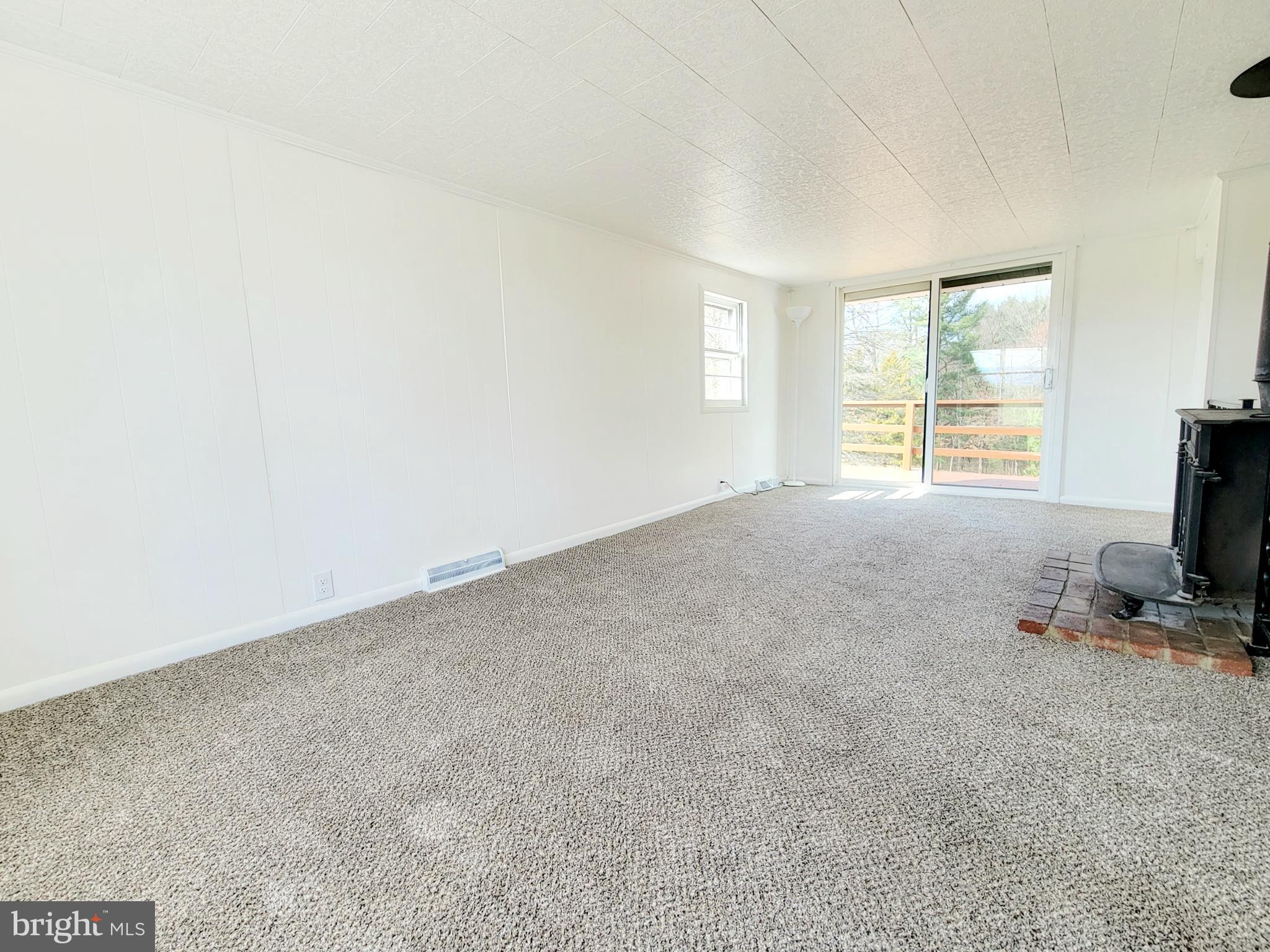 11838 Kieffer Funk Road Hagerstown, MD 21742 - Photo 14 of 34 Family room with back porch access and wood stove