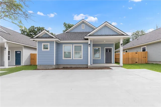 front view of a house with a yard