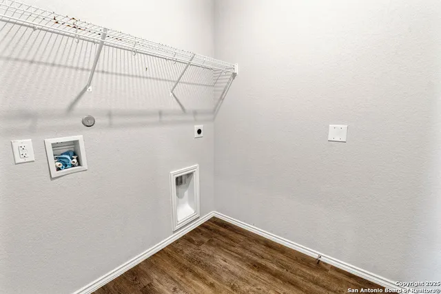 a view of small space with empty racks on the wall