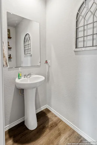 a white sink with white walls