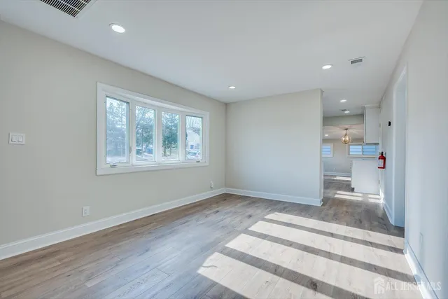 a kitchen with stainless steel appliances granite countertop a sink and refrigerator