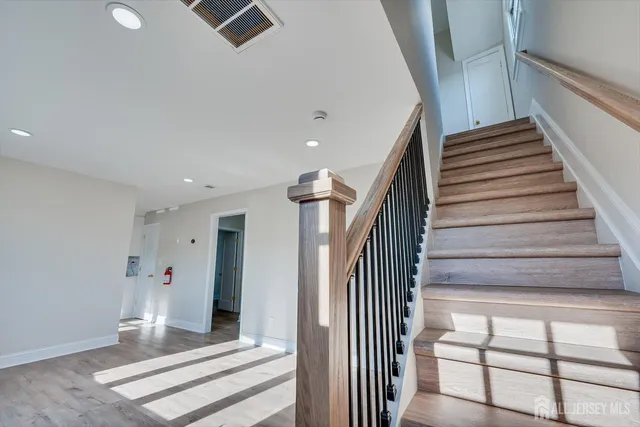a view of wooden floor and windows in an empty room