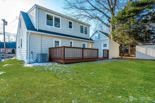 a view of a backyard with large trees