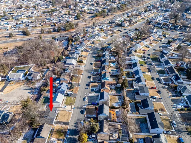 an aerial view of residential building with parking space