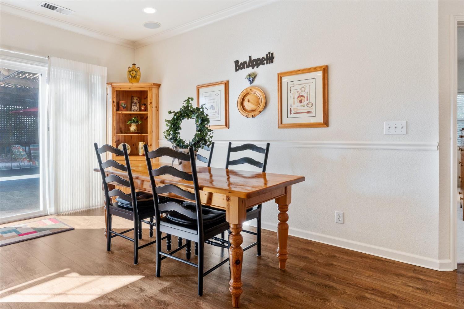 476 Fiddler Court Angels Camp, CA 95222 - Photo 12 of 40 a dining room with furniture and wooden floor