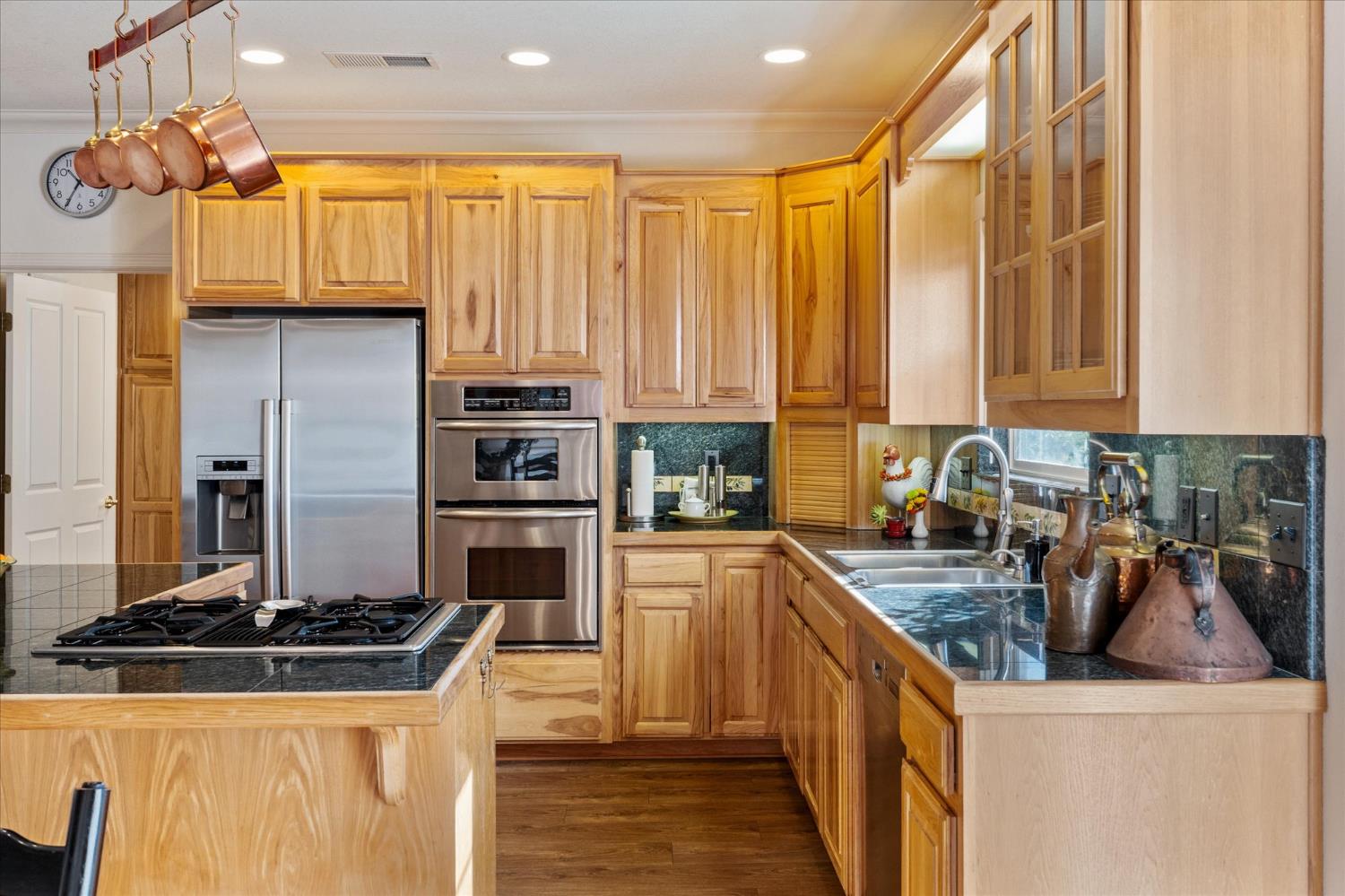 476 Fiddler Court Angels Camp, CA 95222 - Photo 15 of 40 a kitchen with stainless steel appliances granite countertop a stove a sink and a refrigerator