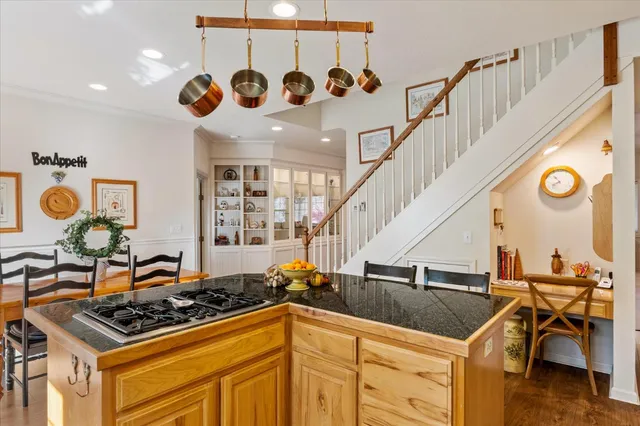 a kitchen with a stove and a table