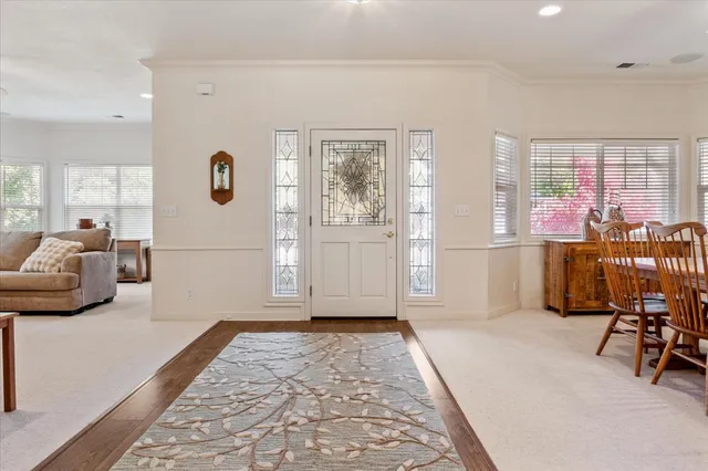 a living room with furniture and a rug