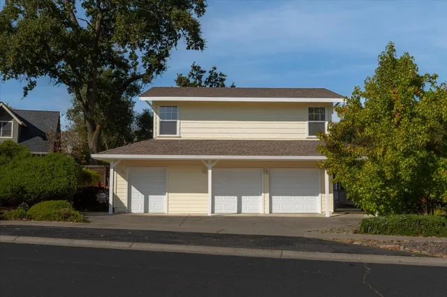 front view of a house with a small yard