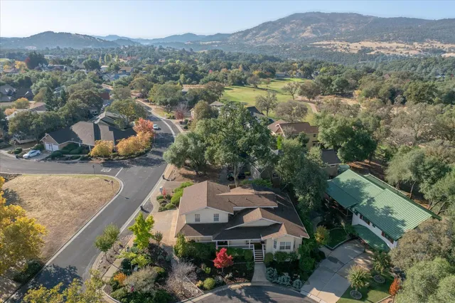 an aerial view of a house with a garden