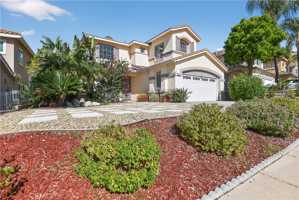 2621 Fallen Leaf Court Simi Valley, CA 93063 - Photo 2 of 58 a front view of a house with garden