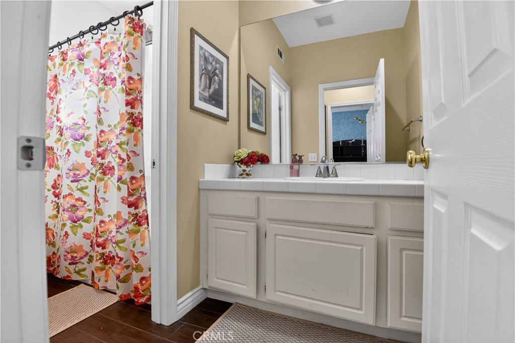 2621 Fallen Leaf Court Simi Valley, CA 93063 - Photo 50 of 58 a bathroom with a sink and a mirror