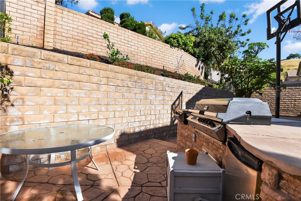 2621 Fallen Leaf Court Simi Valley, CA 93063 - Photo 5 of 58 a backyard of a house with table and chairs