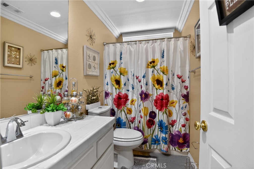 2621 Fallen Leaf Court Simi Valley, CA 93063 - Photo 51 of 58 a bathroom with a sink toilet and shower
