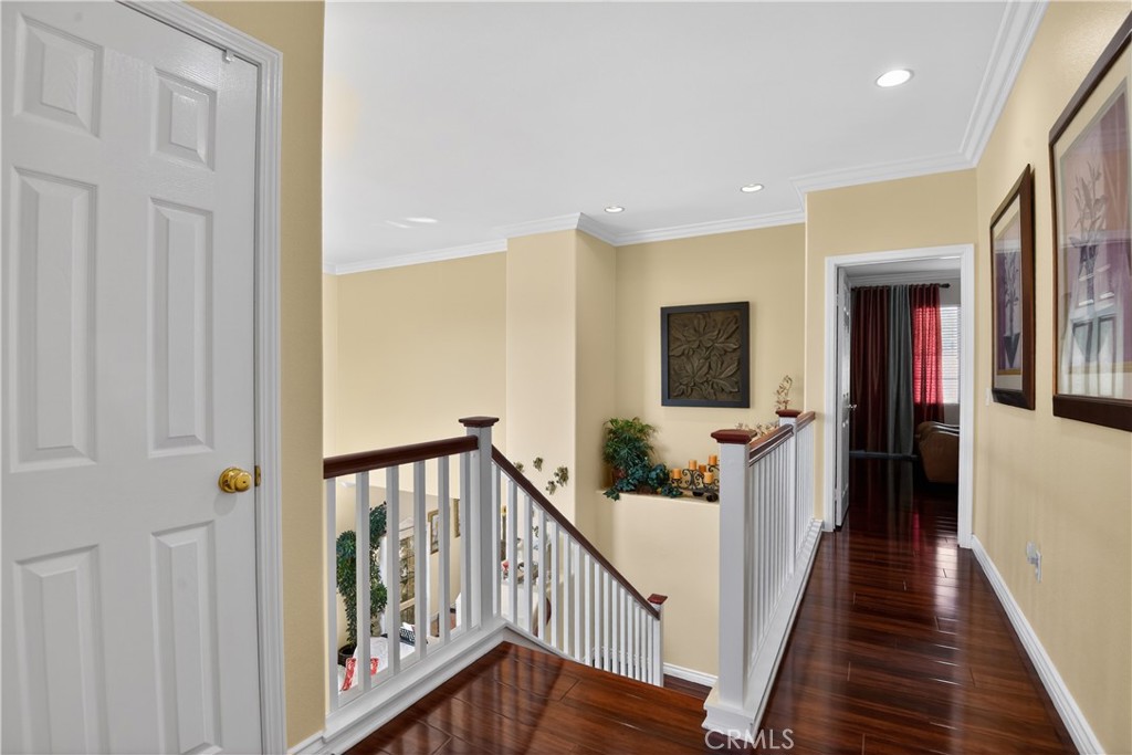 2621 Fallen Leaf Court Simi Valley, CA 93063 - Photo 55 of 58 a view of a hallway with wooden floor and staircase