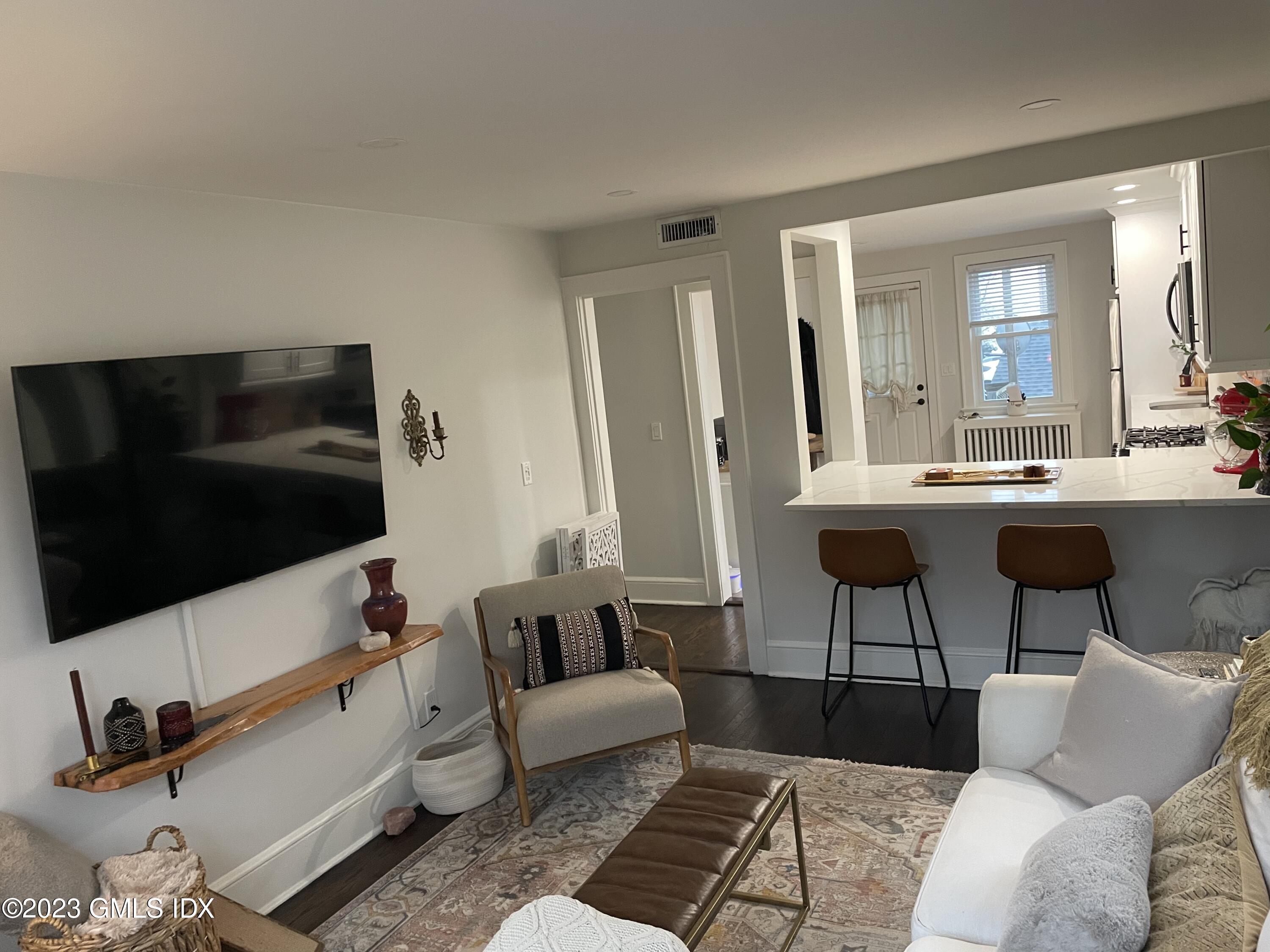 60 Weaver Street, Unit 2 Greenwich, CT 06831 - Photo 11 of 20 a living room with furniture and a flat screen tv
