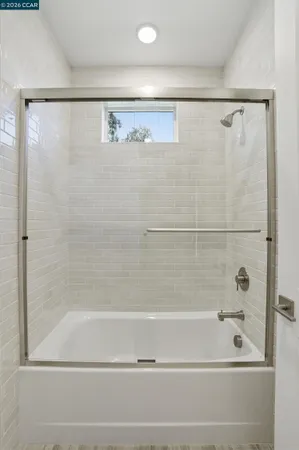 a bathroom with a shower and a bathtub
