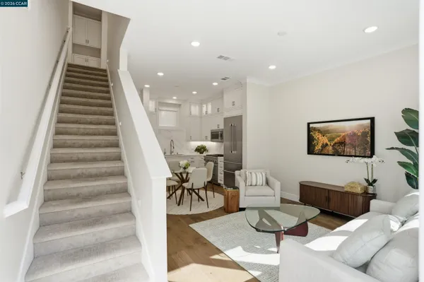 a living room with furniture and white walls