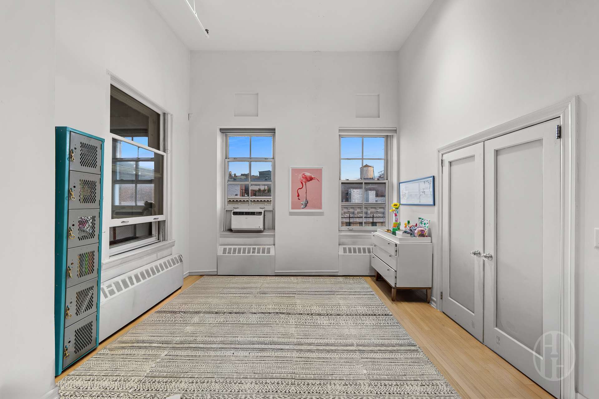 426 West Broadway, Unit 6F Manhattan, NY 10012 - Photo 3 of 13 a room with storage and utility