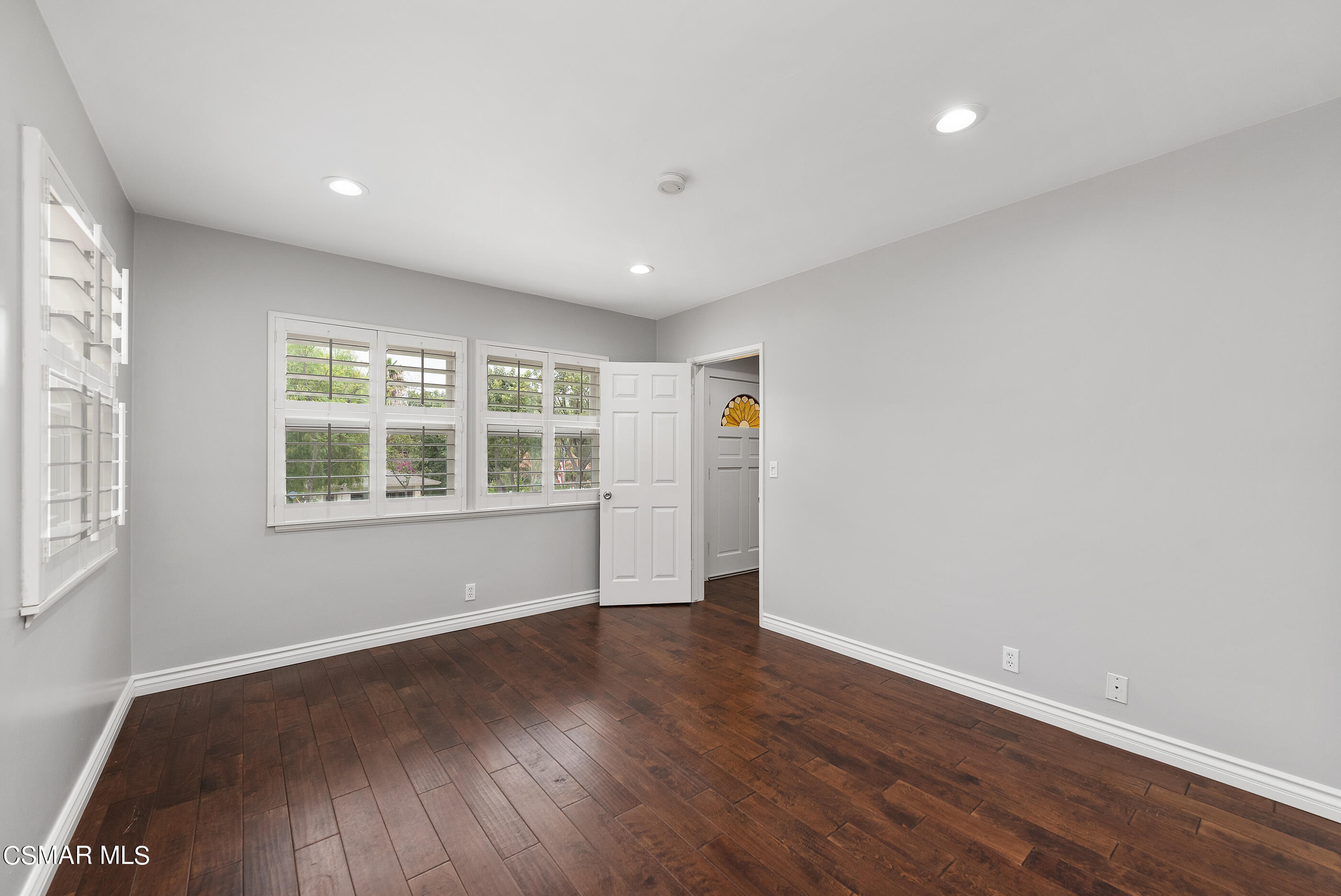 692 Rancho Road Thousand Oaks, CA 91362 - Photo 22 of 55 a view of an empty room with wooden floor and a window