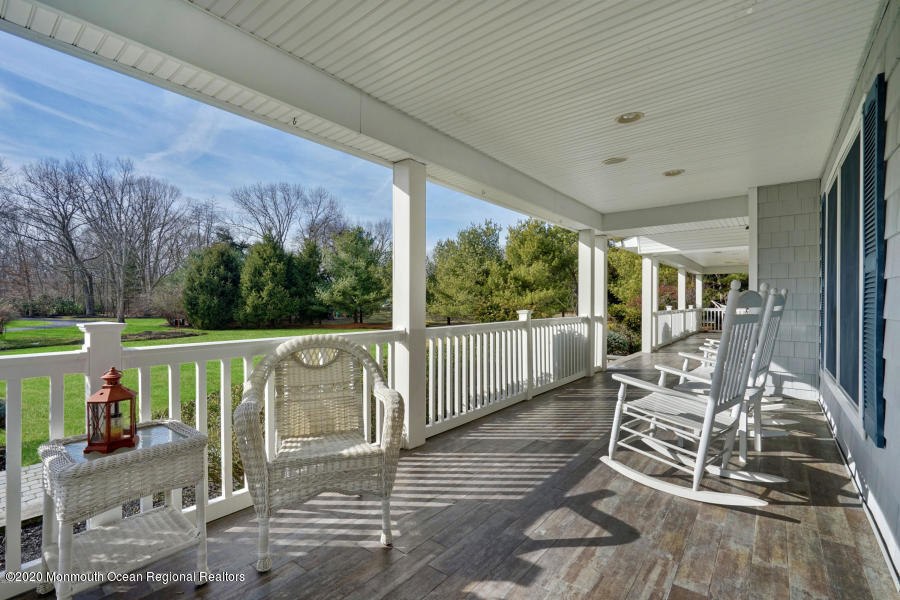 129 Arnold Boulevard Howell, NJ 07731 - Photo 2 of 3 a view of a patio with a table chairs and backyard