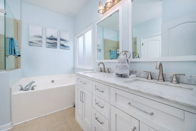 a living room with furniture and a baby crib