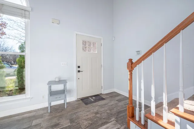 a backyard of a house with chairs and a small yard