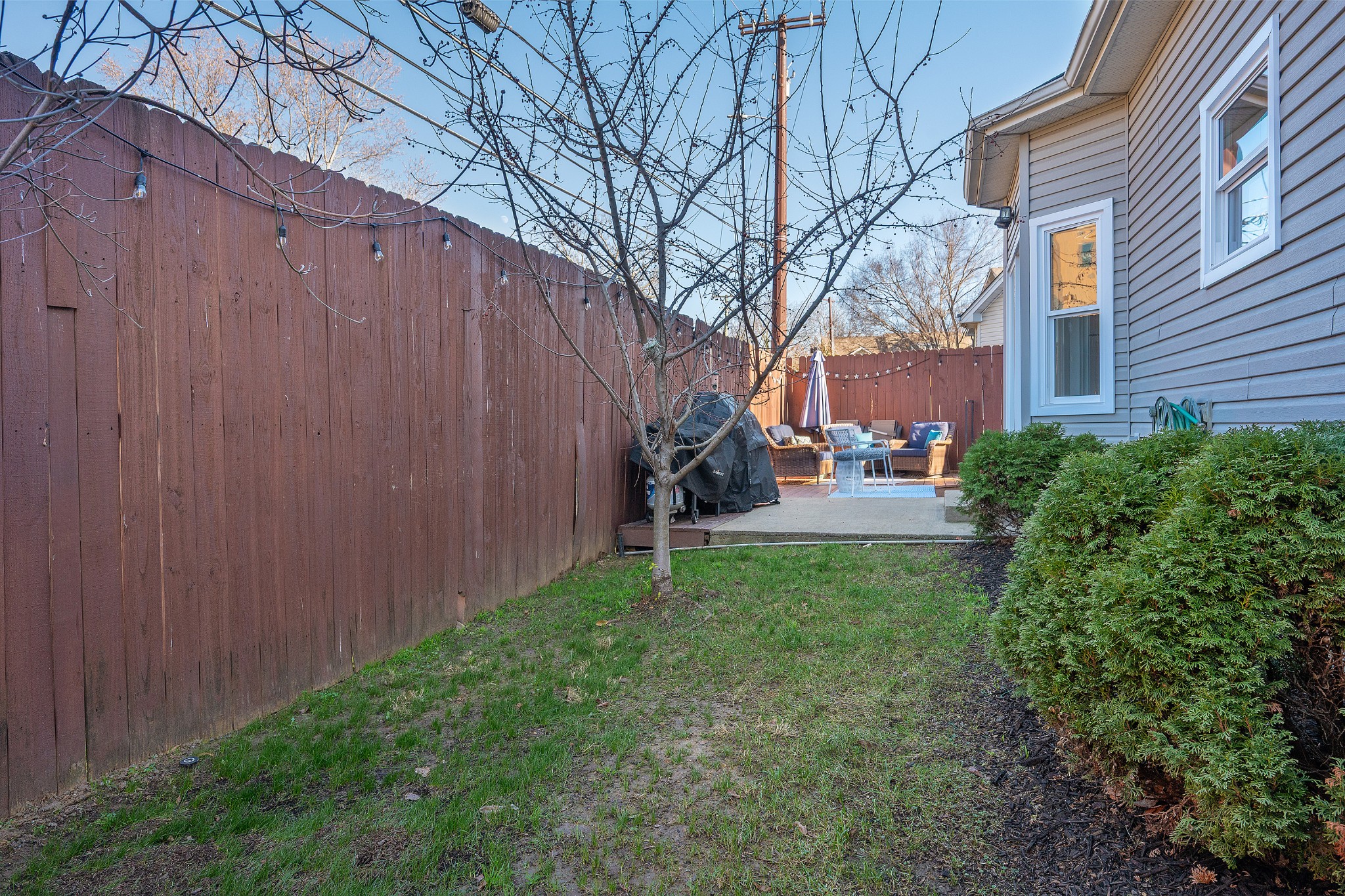 2763 Rosedale Place Nashville, TN 37211 - Photo 30 of 40 a backyard of a house with chairs and a small yard