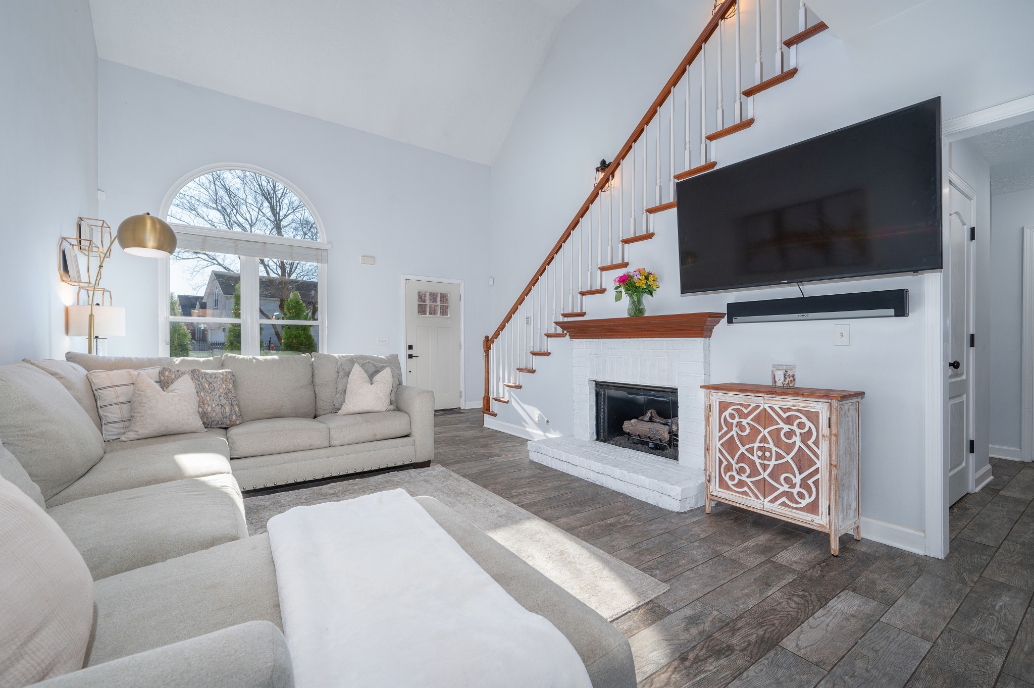 2763 Rosedale Place Nashville, TN 37211 - Photo 6 of 40 a living room with furniture a flat screen tv and a fireplace