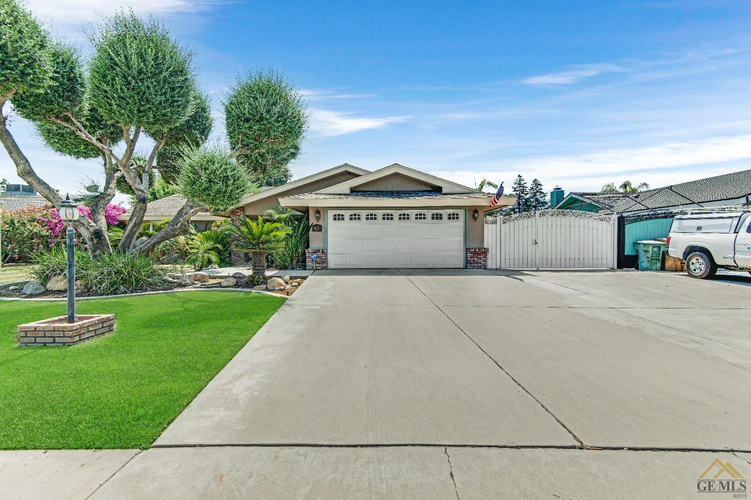 Undisclosed Address Bakersfield, CA 93311 - Photo 1 of 50 a view of a house with a yard and potted plants